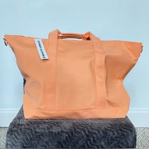 Stony clover lane classic tote bag in the color peach